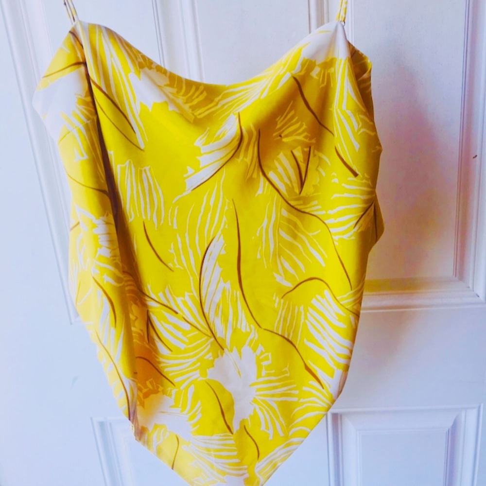 Yellow floral camisole with bow strap on the backside.